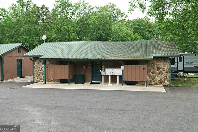 front view of a house with table and chairs