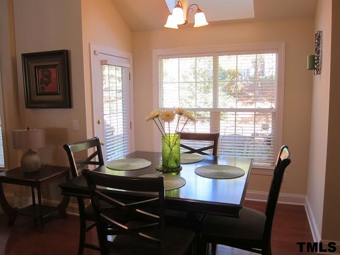 11238 Maplecroft Court Raleigh, NC 27617 - Photo 2 of 12 a view of a dining room with furniture window and outside view