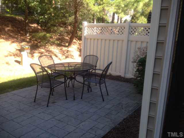 11238 Maplecroft Court Raleigh, NC 27617 - Photo 11 of 12 a patio with table and chairs