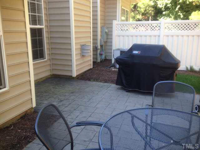 11238 Maplecroft Court Raleigh, NC 27617 - Photo 12 of 12 a view of a balcony with chair and a potted plant