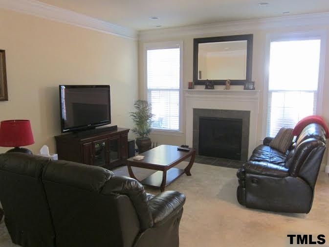 11238 Maplecroft Court Raleigh, NC 27617 - Photo 3 of 12 a living room with furniture and a flat screen tv