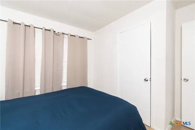 a view of a closet in a bedroom