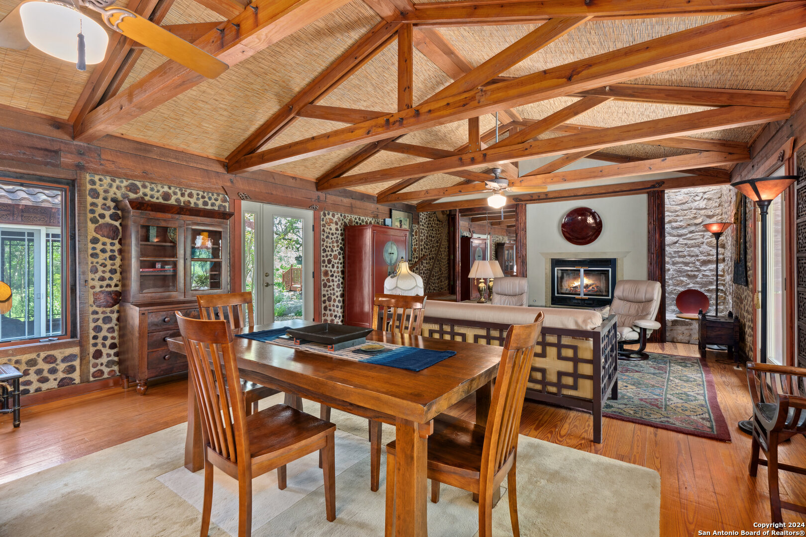 801 Mickle Creek Road Medina, TX 78055 - Photo 17 of 55 a view of a dining room with furniture and chandelier