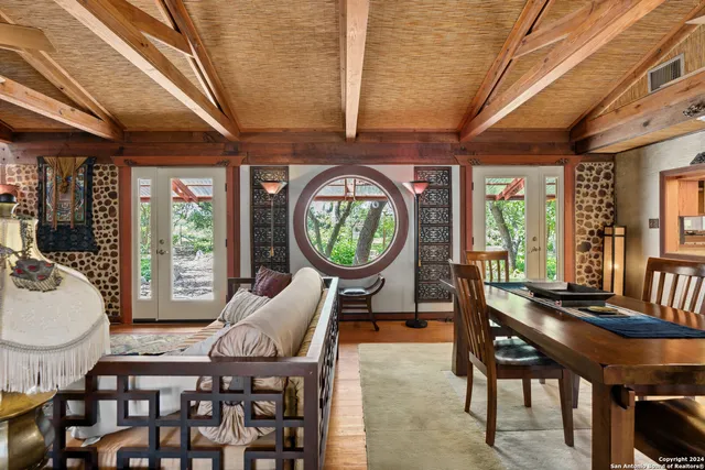 a view of a dining room with furniture window and outside view