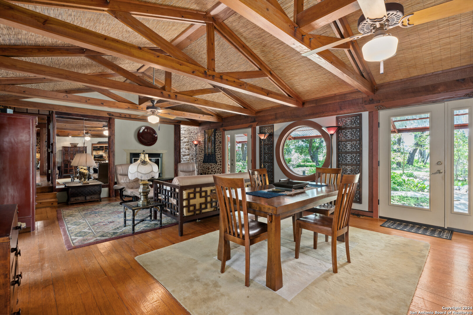 801 Mickle Creek Road Medina, TX 78055 - Photo 19 of 55 a view of a dining room with furniture window and outside view