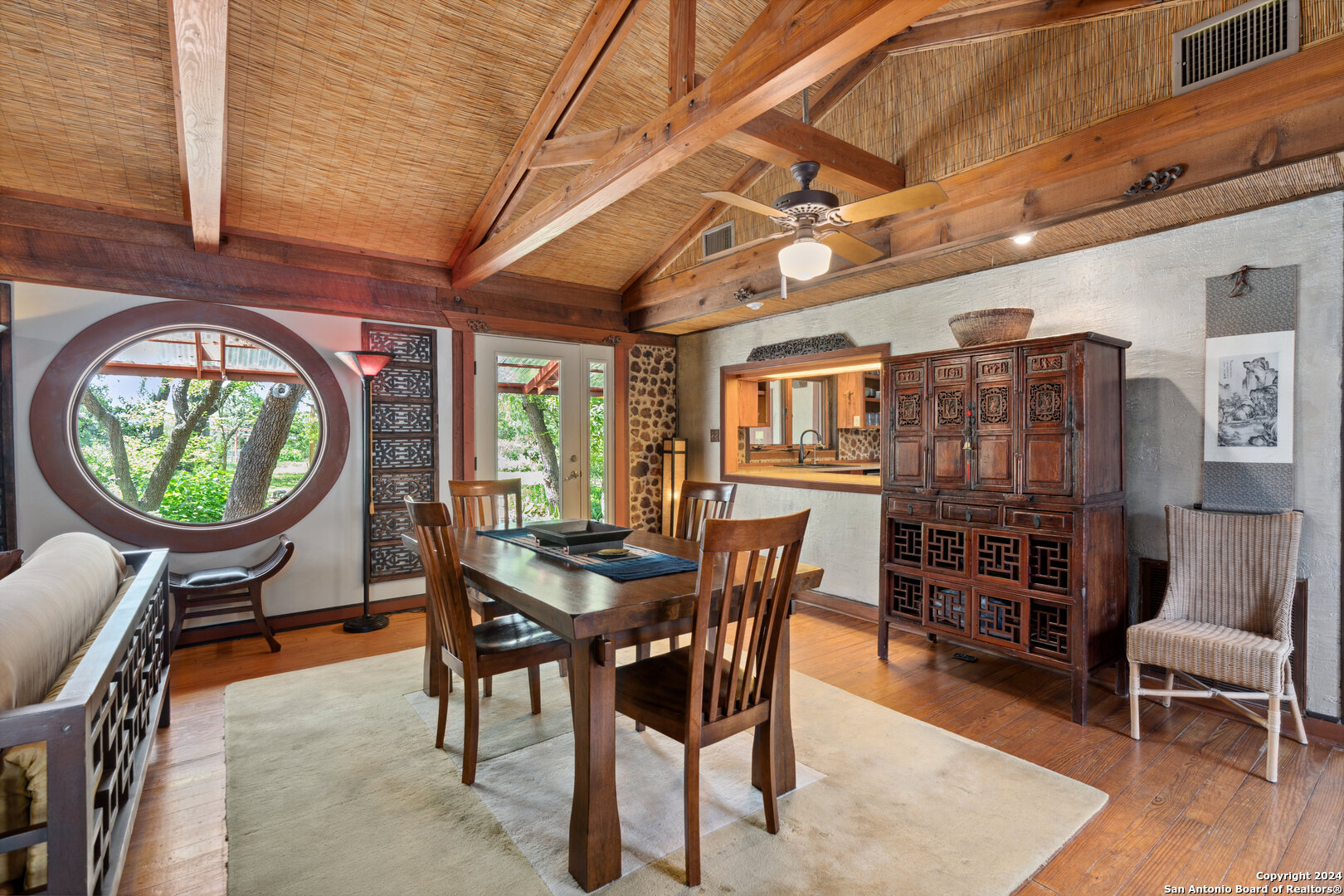 801 Mickle Creek Road Medina, TX 78055 - Photo 20 of 55 a dining room with furniture a rug and wooden floor