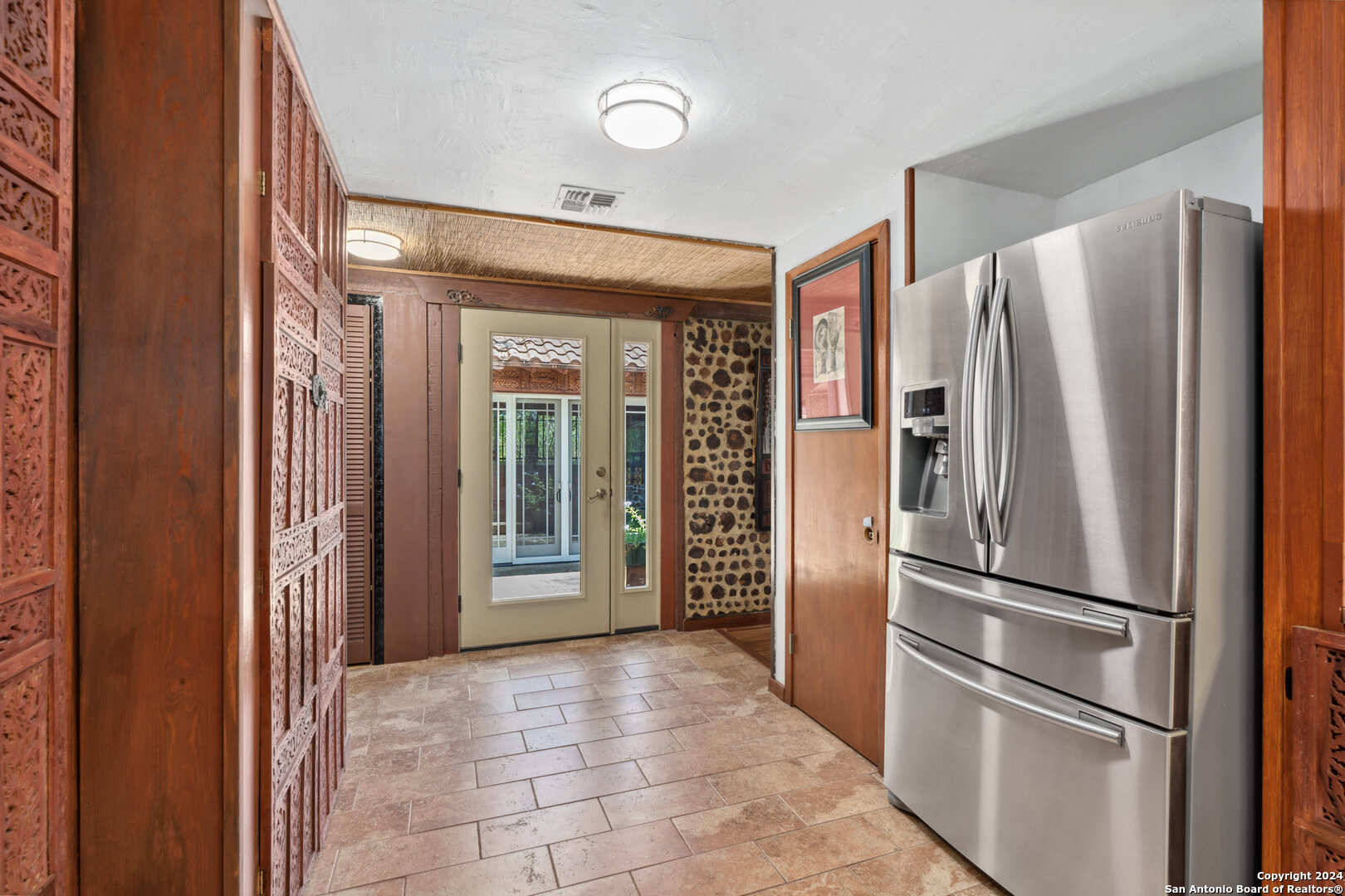 801 Mickle Creek Road Medina, TX 78055 - Photo 25 of 55 a kitchen with stainless steel appliances a refrigerator and microwave