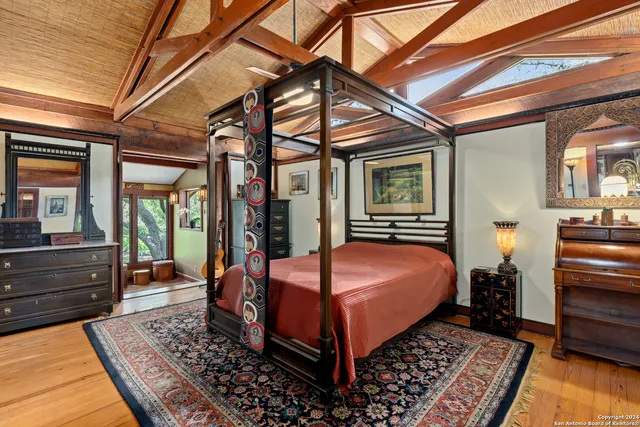 a bedroom with a bed and a walk in closet