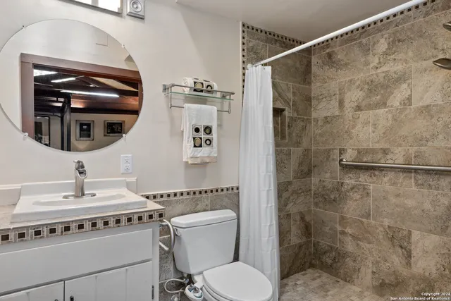 a view of a livingroom with furniture and staircase