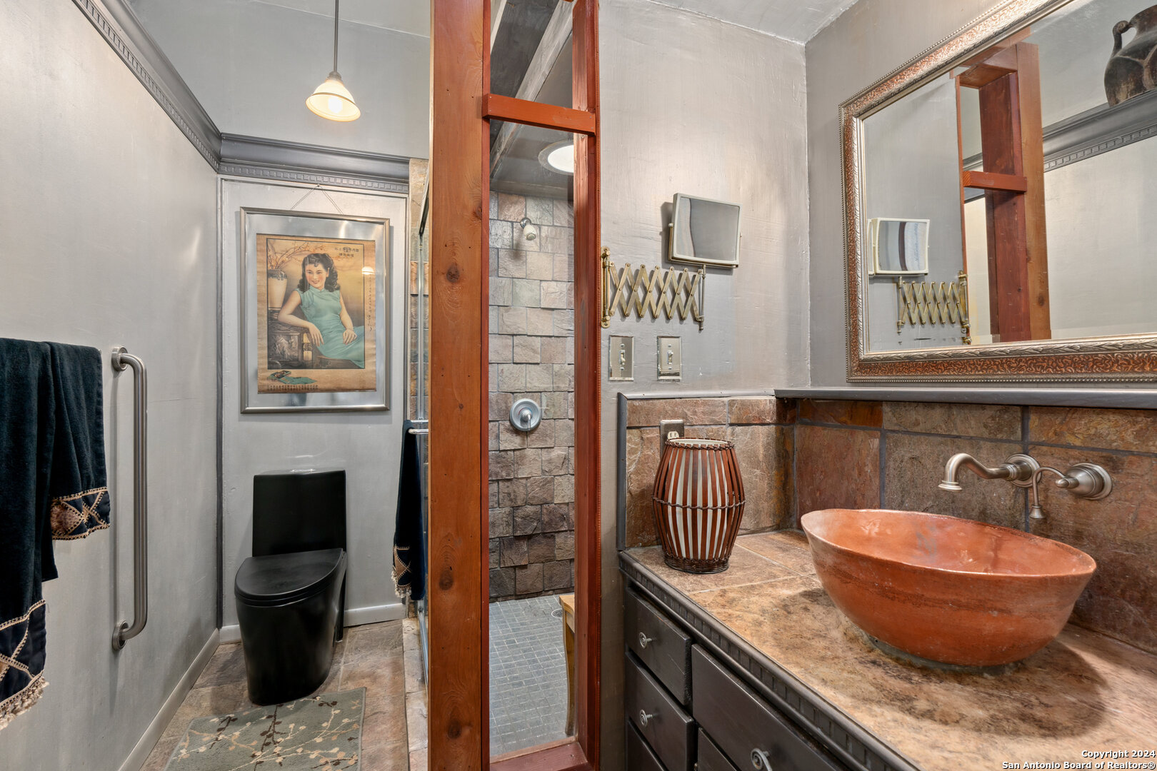 801 Mickle Creek Road Medina, TX 78055 - Photo 37 of 55 a bathroom with a granite countertop toilet sink and mirror