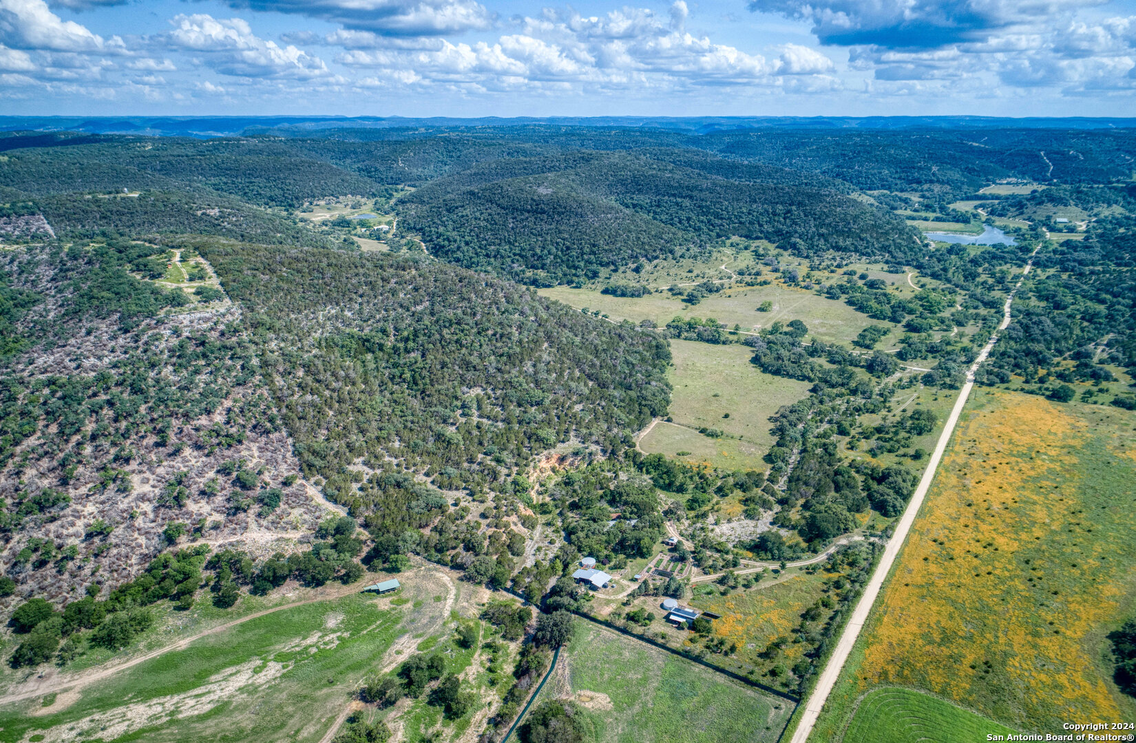 801 Mickle Creek Road Medina, TX 78055 - Photo 5 of 55 an aerial view of a residential houses with outdoor space