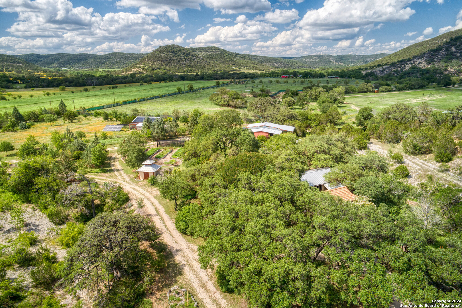 801 Mickle Creek Road Medina, TX 78055 - Photo 53 of 55 a view of a lake with a city