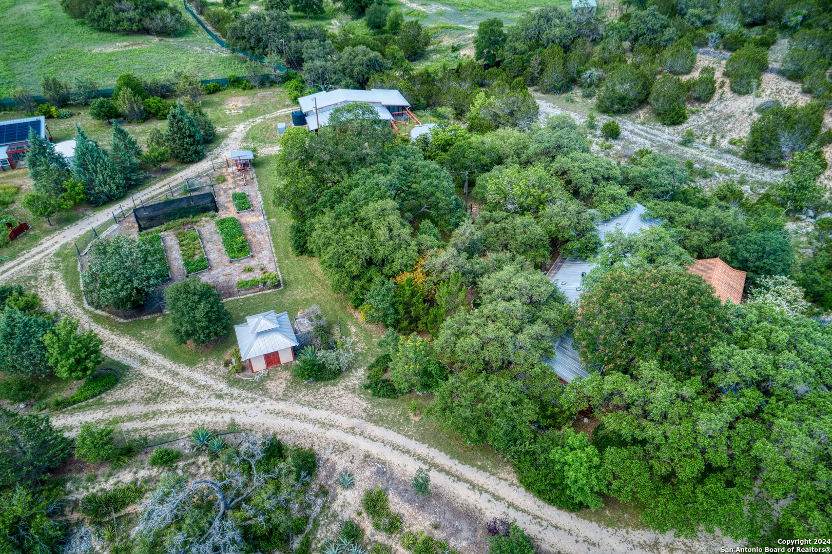 801 Mickle Creek Road Medina, TX 78055 - Photo 54 of 55 an aerial view of a house with a yard and lake view