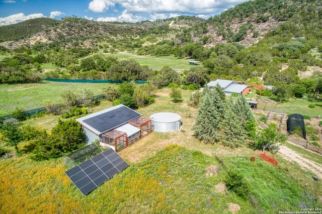 a view of a swimming pool with a yard