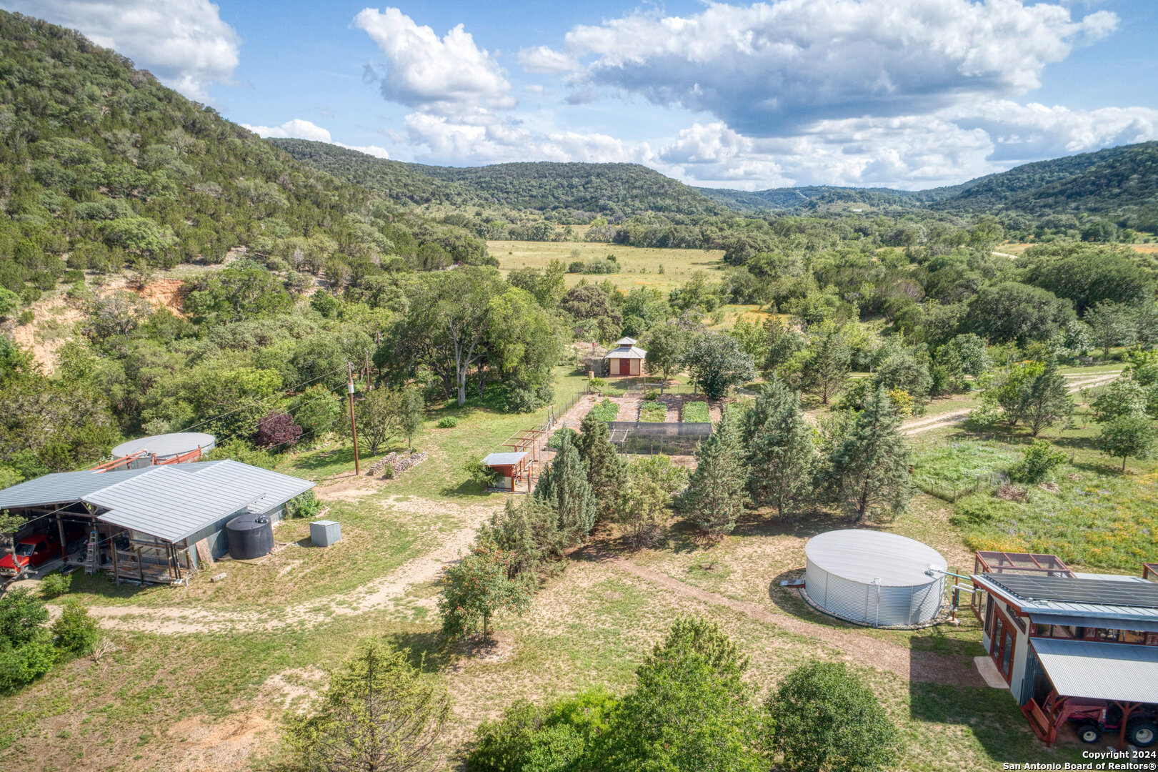801 Mickle Creek Road Medina, TX 78055 - Photo 7 of 55 a view of a swimming pool with a yard
