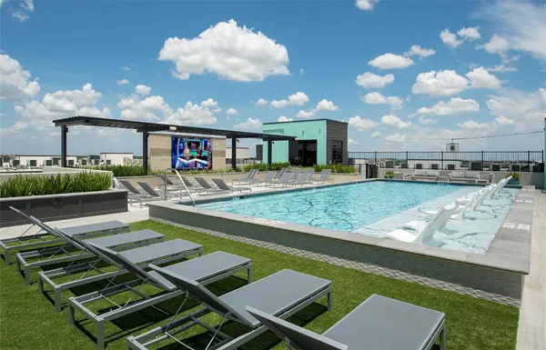 a view of a swimming pool with seating area