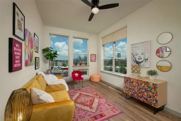 a living room with furniture and a window