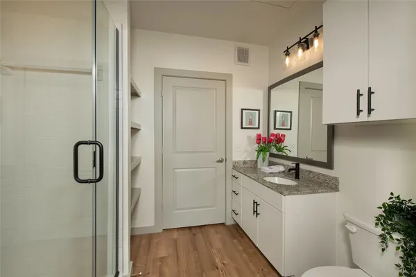 a kitchen with a refrigerator and a sink