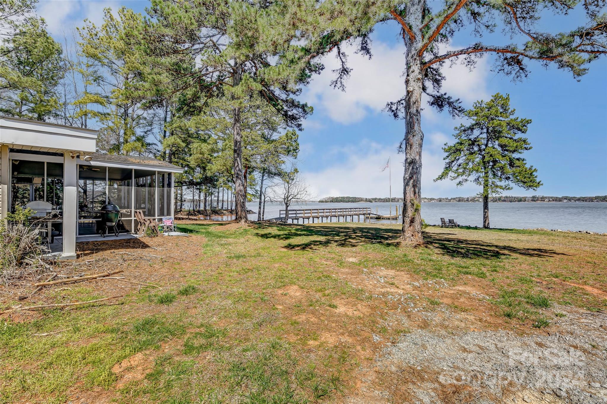 8303 Luckey Point Road Denver, NC 28037 - Photo 19 of 20 a view of a swimming pool with an outdoor space and seating area