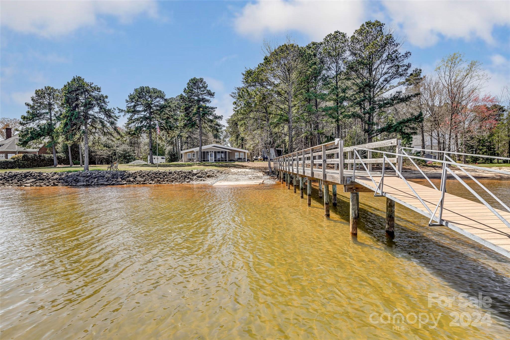 8303 Luckey Point Road Denver, NC 28037 - Photo 20 of 20 a view of a swimming pool with an outdoor seating and a yard