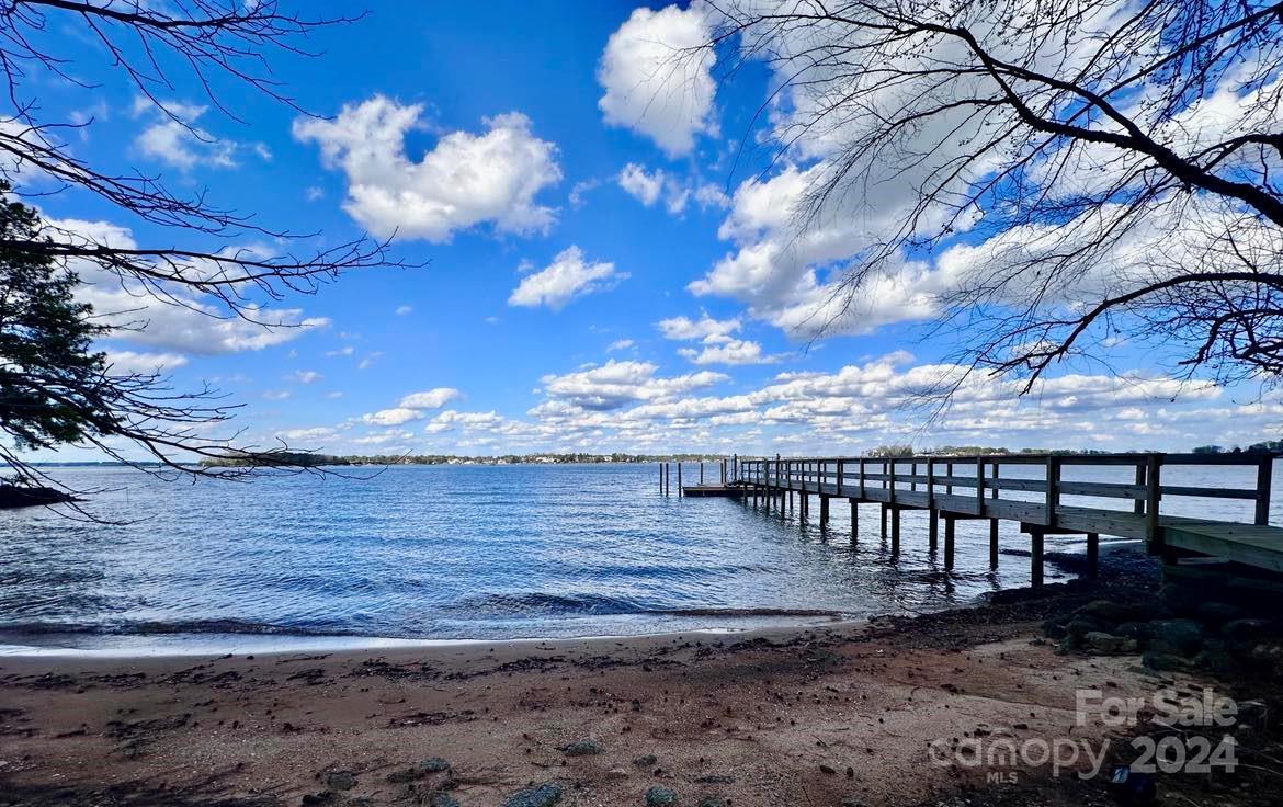 8303 Luckey Point Road Denver, NC 28037 - Photo 4 of 20 a view of a yard with wooden fence