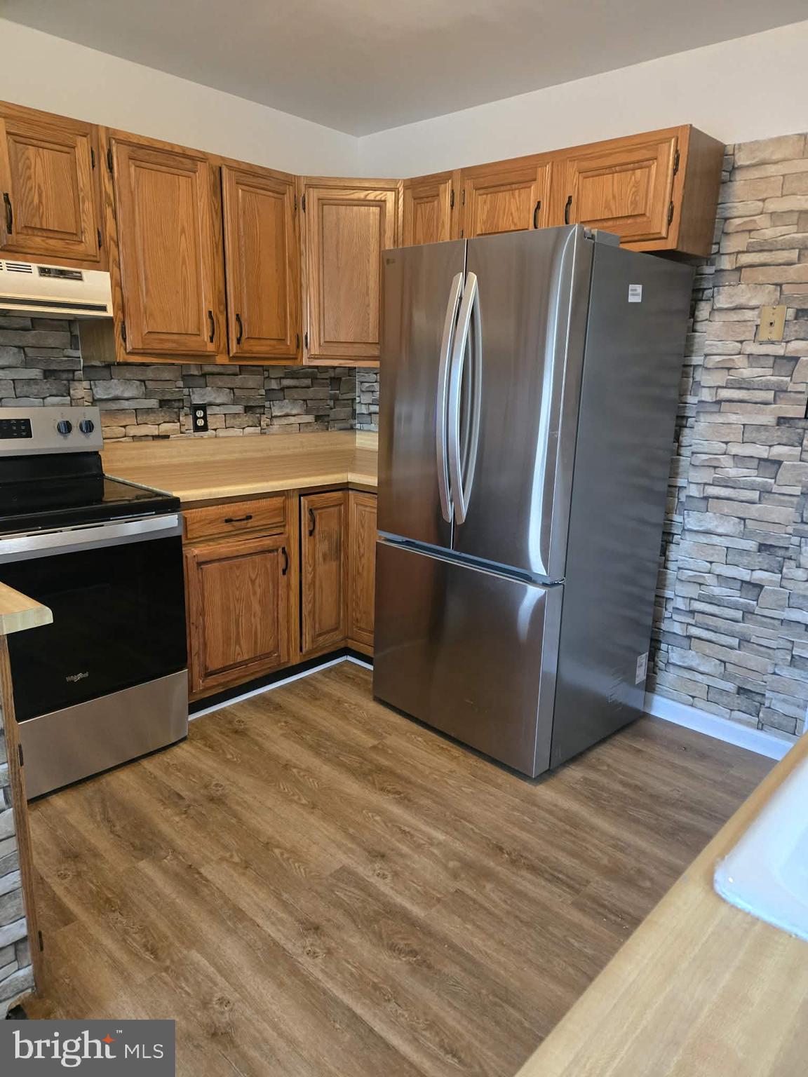 306 Ryan Drive Rising Sun, MD 21911 - Photo 6 of 23 a kitchen with stainless steel appliances granite countertop a refrigerator sink and cabinets