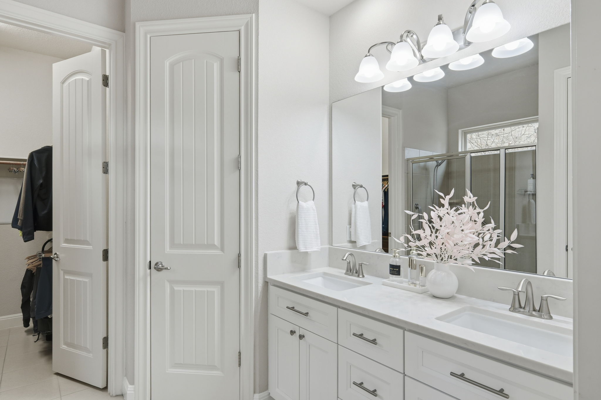 2608 Barbera Pass, Unit 90 Austin, TX 78748 - Photo 12 of 37 Primary bathroom showing dual sinks and drawers in the middle of cabinets and cabinet pop-out in front of sink.