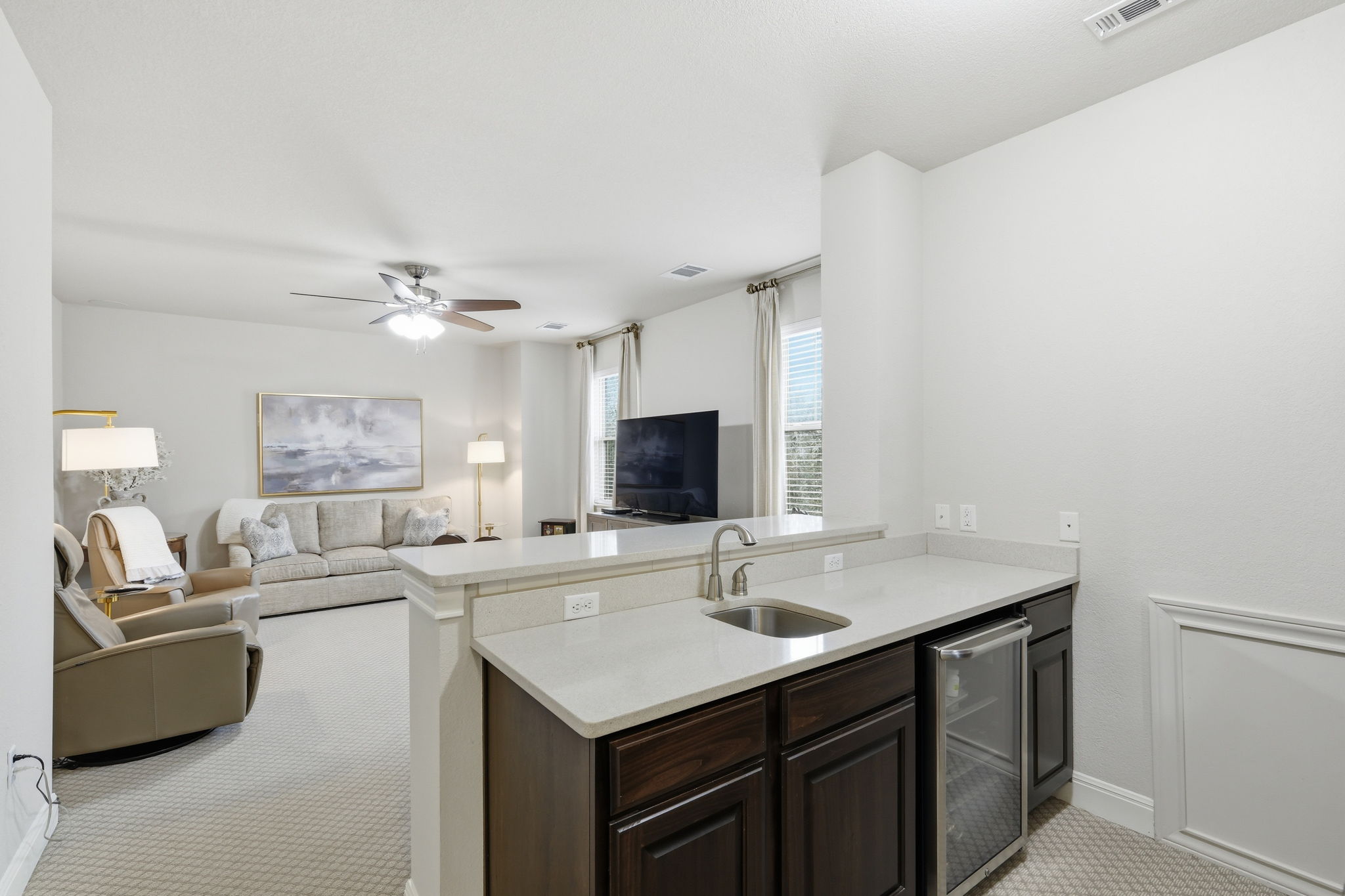 2608 Barbera Pass, Unit 90 Austin, TX 78748 - Photo 19 of 37 Upstairs Media/Game Room with wet bar and mini refrigerator.