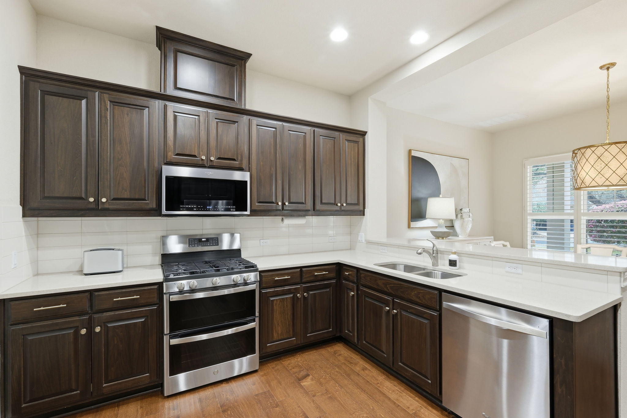 2608 Barbera Pass, Unit 90 Austin, TX 78748 - Photo 8 of 37 Kitchen view showing the stainless steel appliances with double oven in stove.