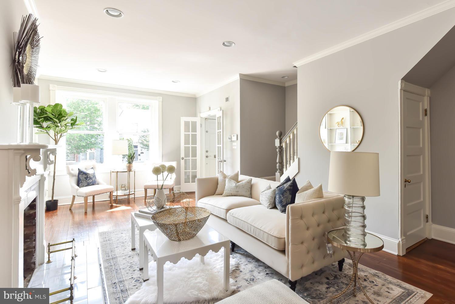 308 11th Street Southeast Washington, DC 20003 - Photo 15 of 30 a living room with furniture a large window and wooden floor