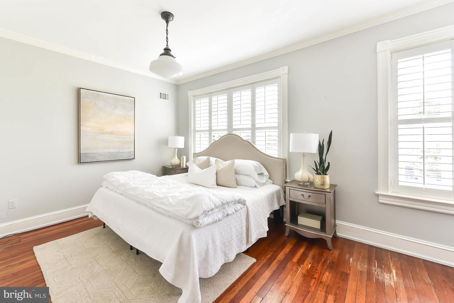 308 11th Street Southeast Washington, DC 20003 - Photo 16 of 30 a bedroom with a bed and a window