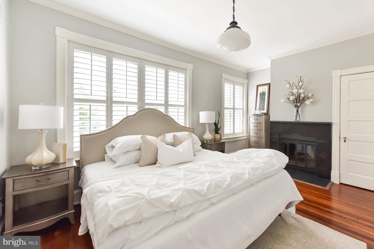 308 11th Street Southeast Washington, DC 20003 - Photo 18 of 30 a bedroom with a bed and a window