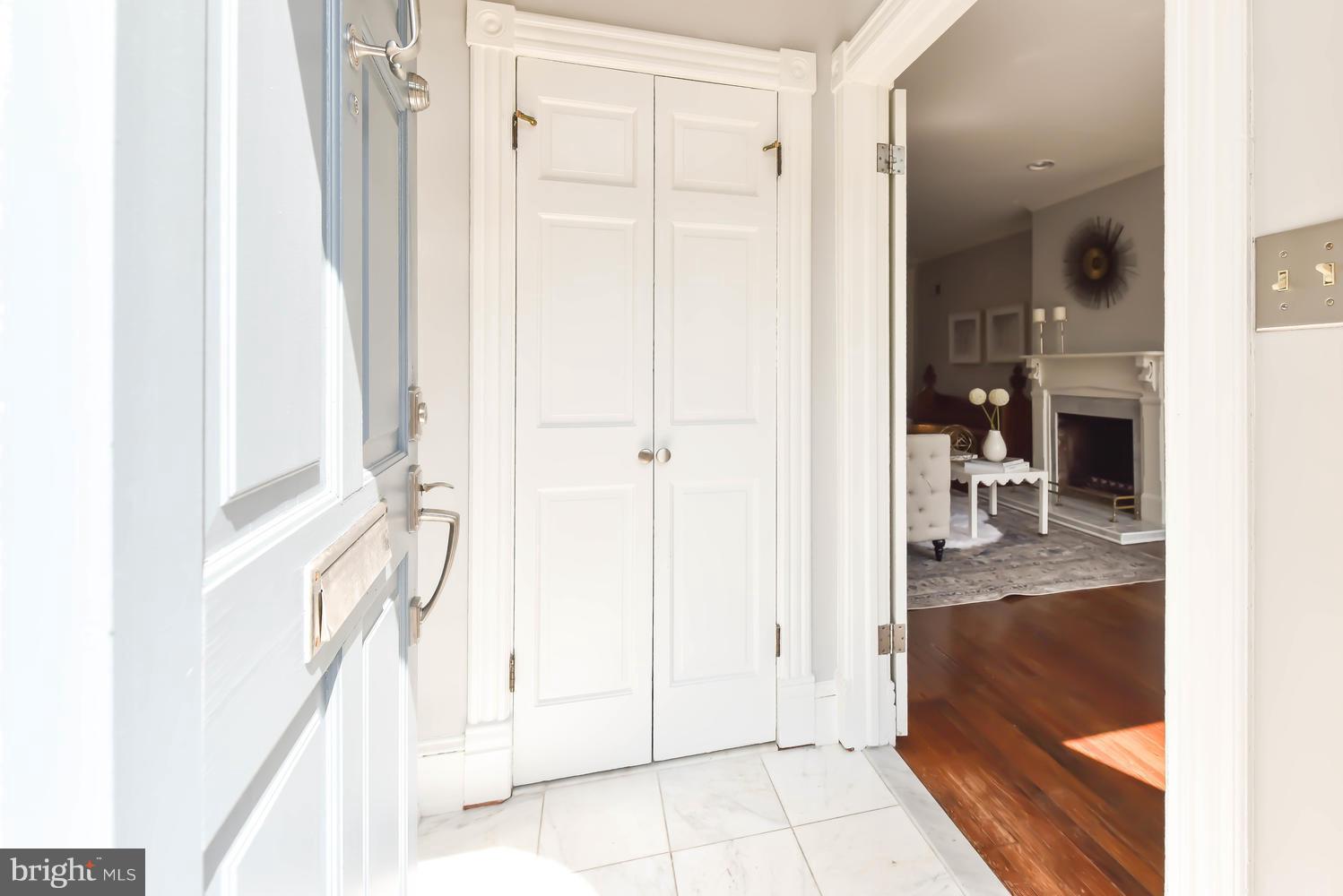 308 11th Street Southeast Washington, DC 20003 - Photo 3 of 30 a view of a hallway with wooden floor windows and a kitchen