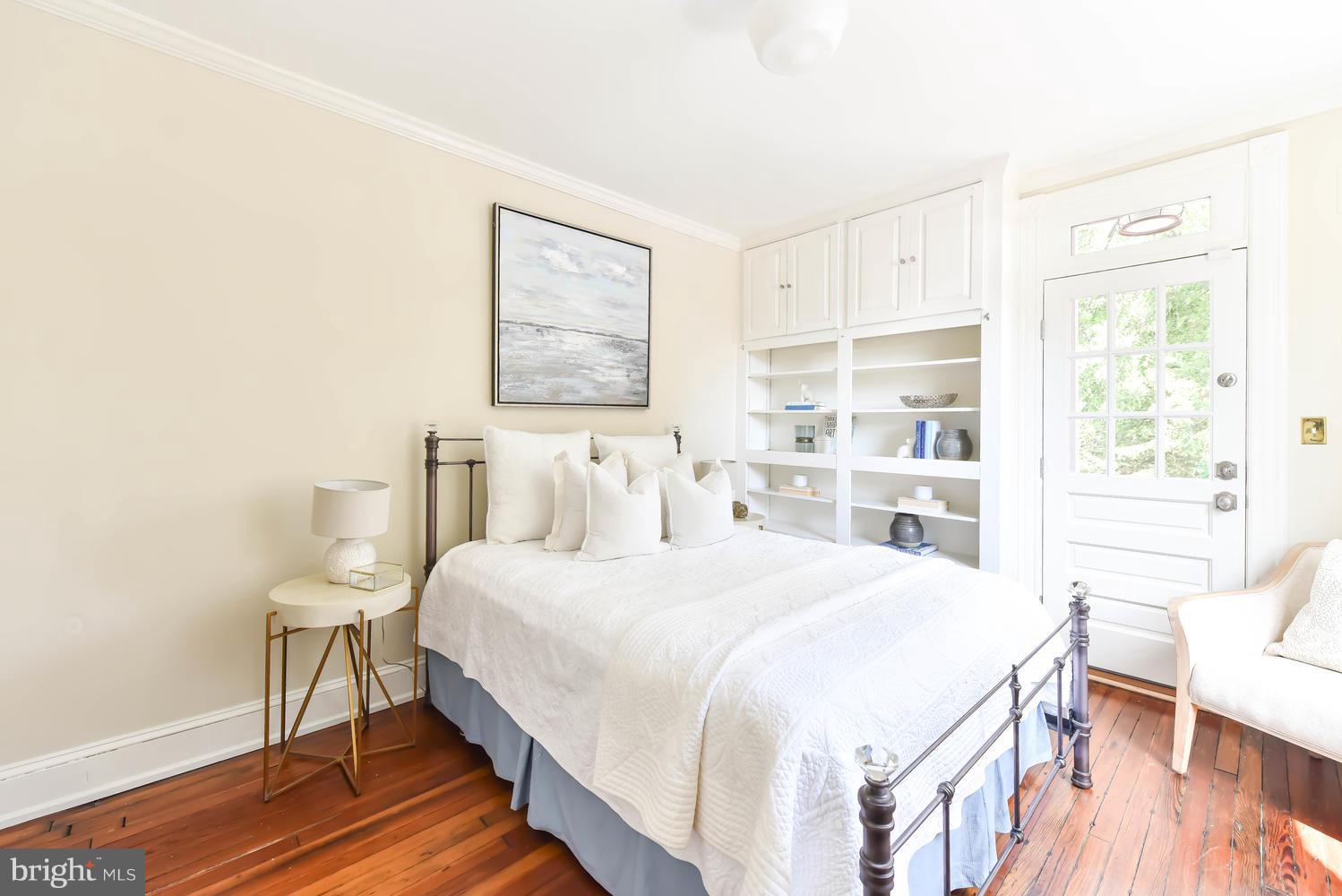 308 11th Street Southeast Washington, DC 20003 - Photo 21 of 30 a bedroom with a bed and a table in it