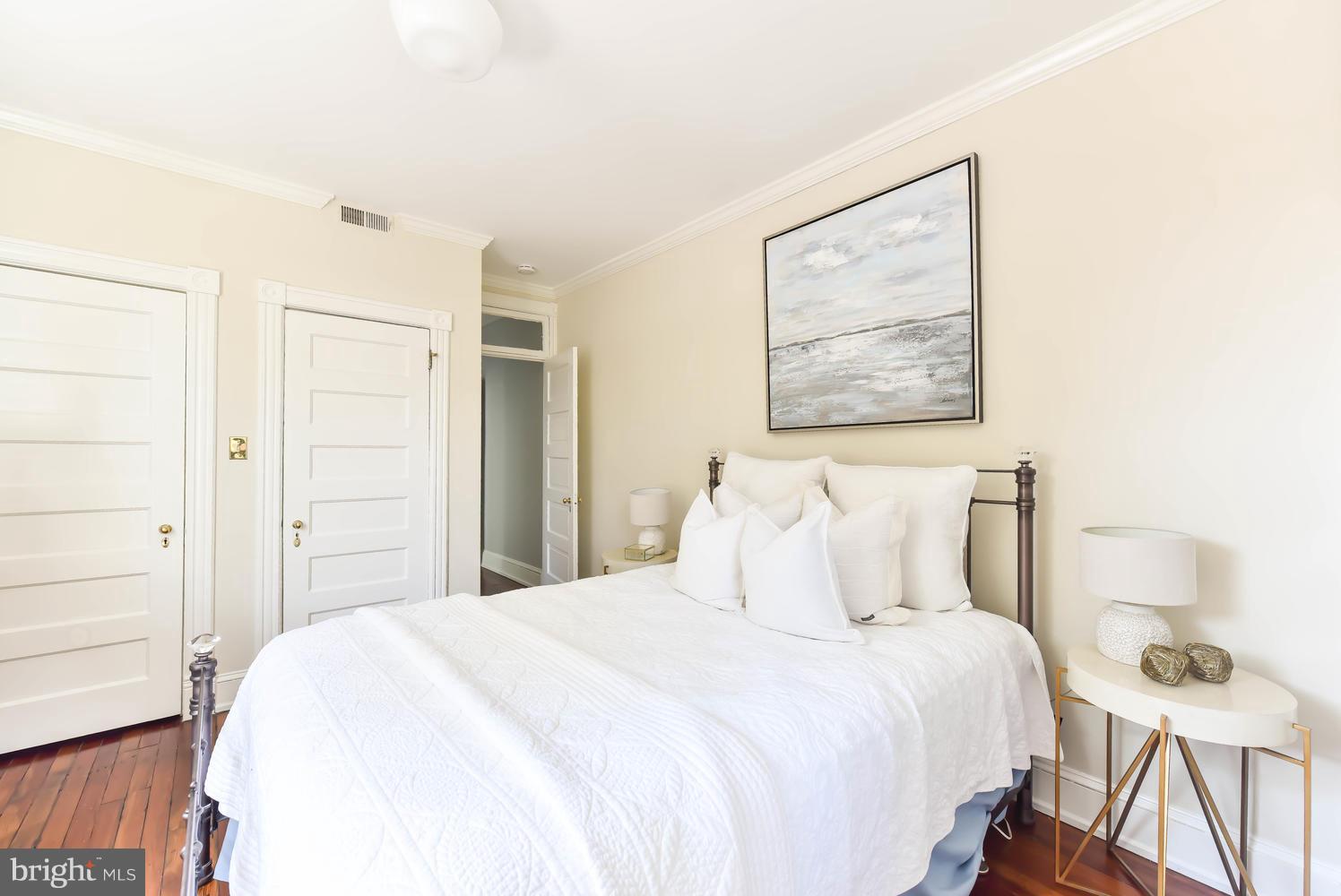 308 11th Street Southeast Washington, DC 20003 - Photo 22 of 30 a bedroom with a bed and a painting on the wall