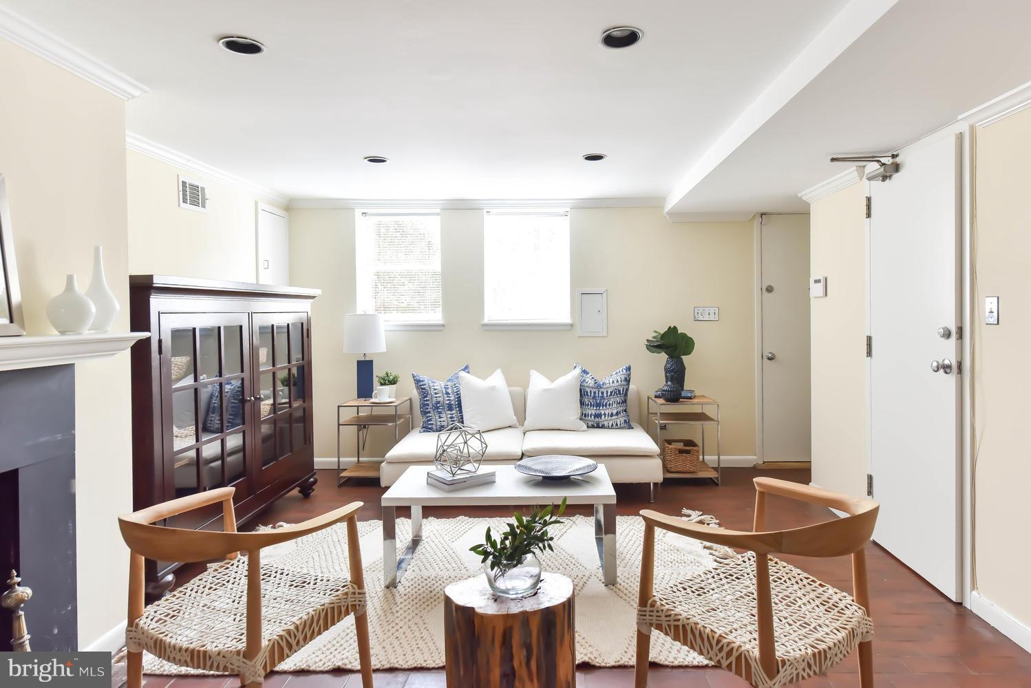 308 11th Street Southeast Washington, DC 20003 - Photo 26 of 30 a living room with furniture a table and a potted plant