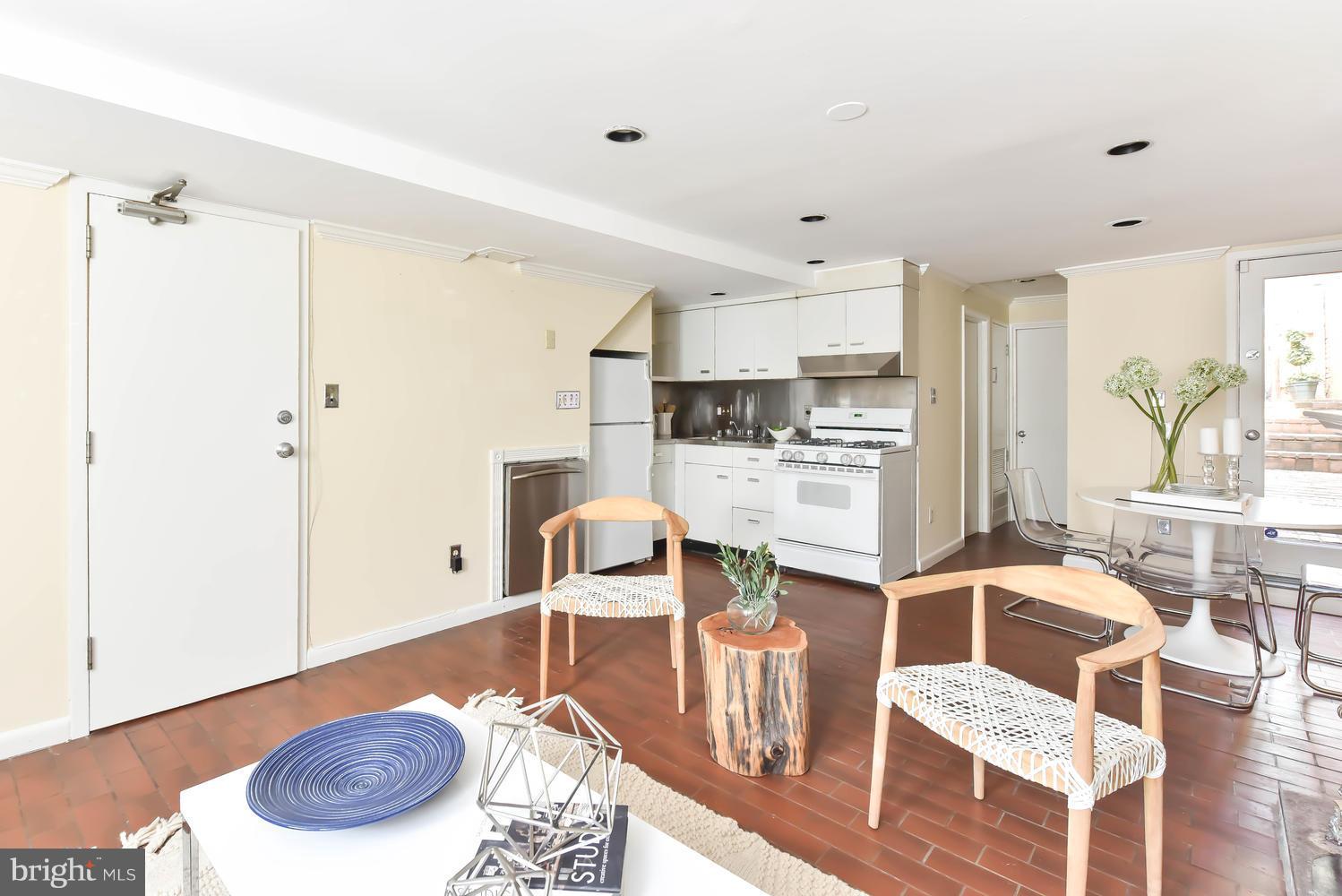 308 11th Street Southeast Washington, DC 20003 - Photo 27 of 30 a living room with furniture and a wooden floor