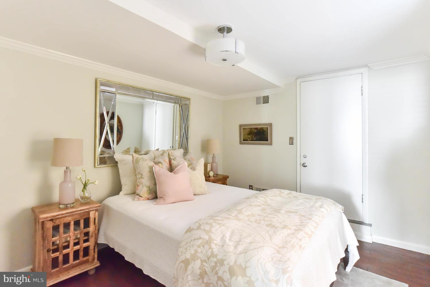 308 11th Street Southeast Washington, DC 20003 - Photo 29 of 30 a bedroom with a bed a dresser and next to a window