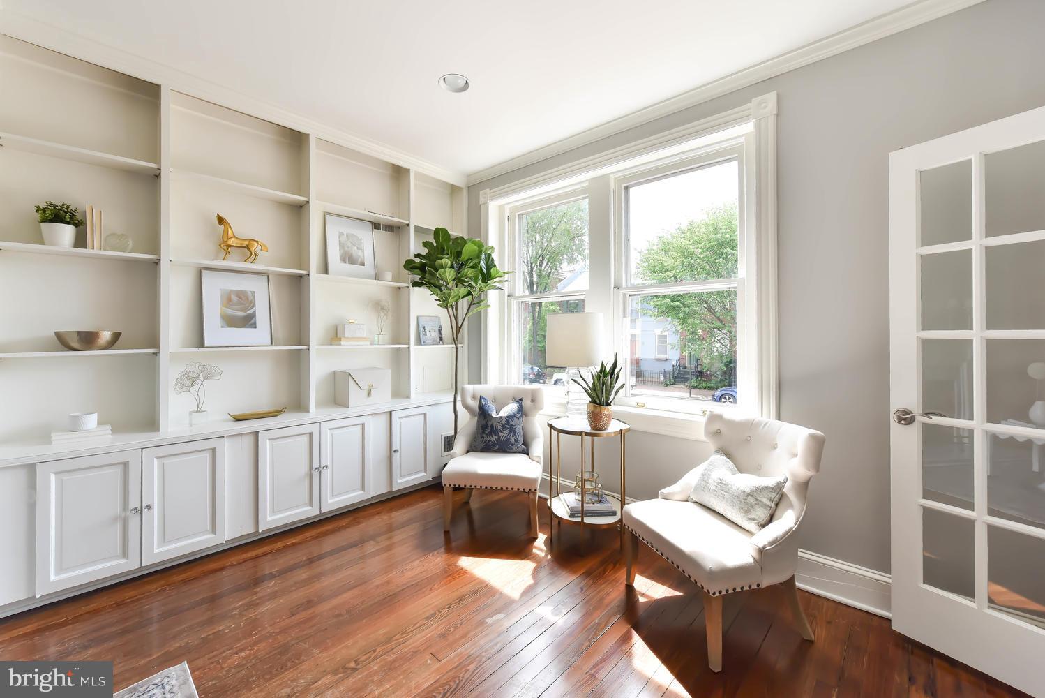 308 11th Street Southeast Washington, DC 20003 - Photo 5 of 30 a living room with furniture a rug potted plant and a window