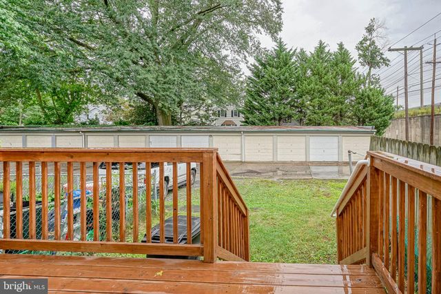 a view of a brick building next to a big yard