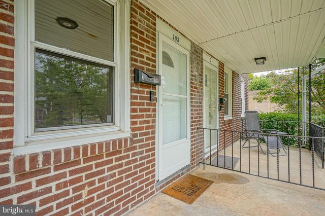 a view of a porch with a floor to ceiling window