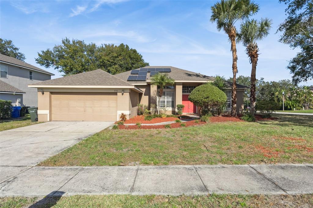774 Lancer Circle Ocoee, FL 34761 - Photo 1 of 35 a view of a house with backyard and garden