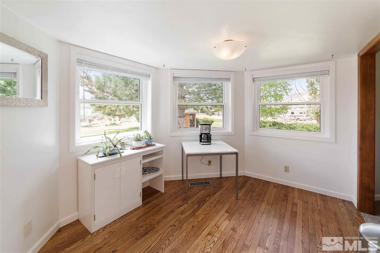 10813 Santa Fe Road Reno, NV 89508 - Photo 12 of 25 a kitchen with a sink and wooden floor