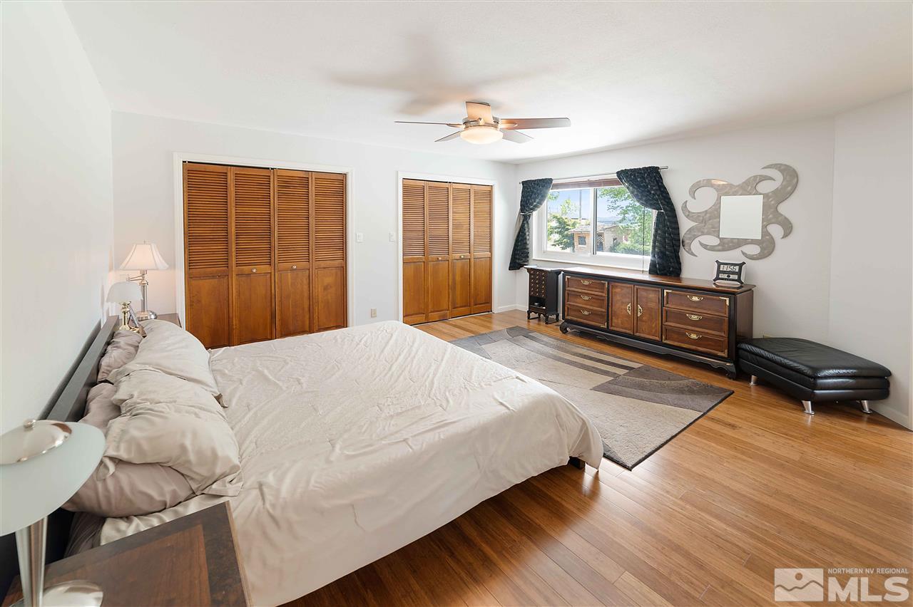 10813 Santa Fe Road Reno, NV 89508 - Photo 14 of 25 a bedroom with a bed and a window