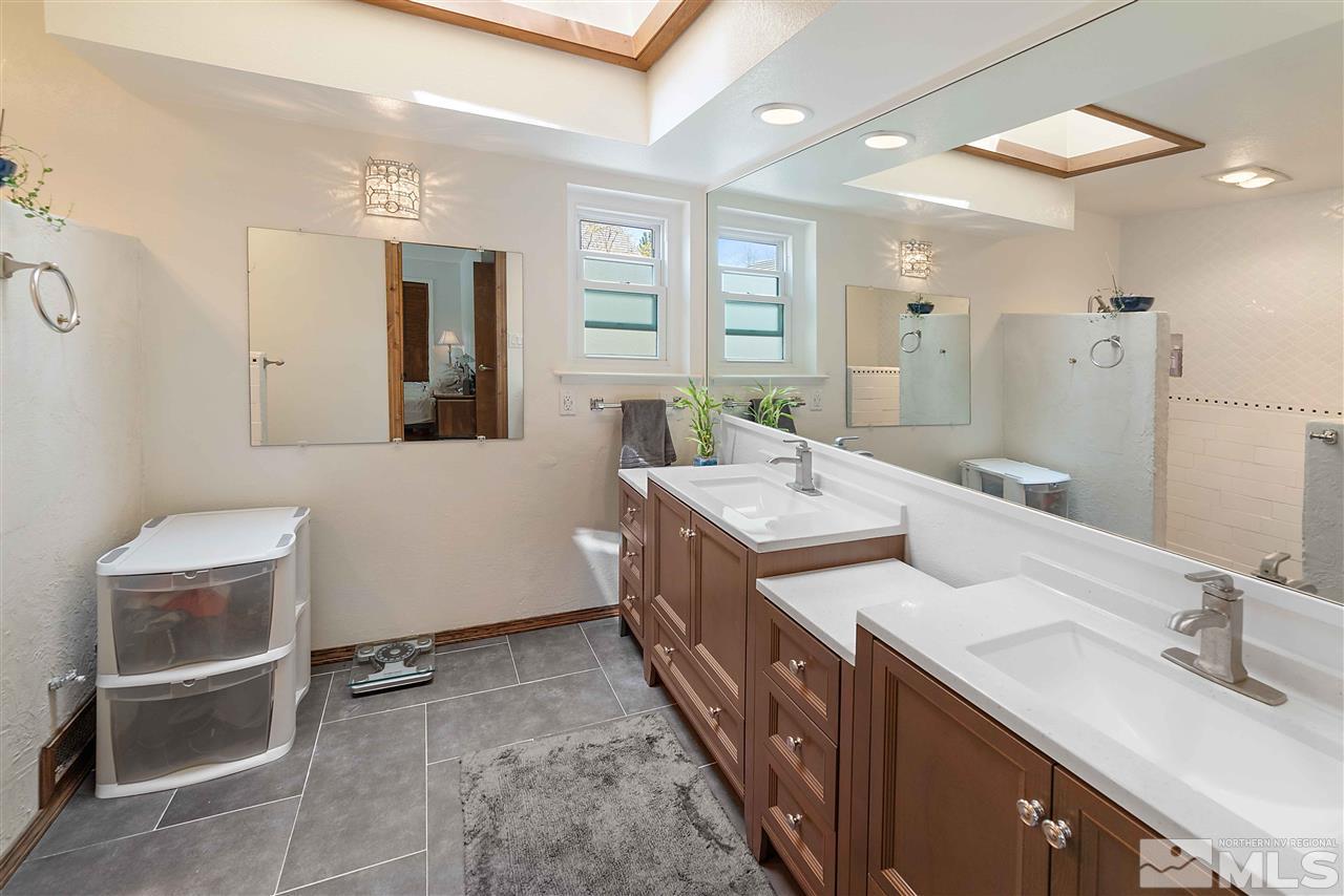 10813 Santa Fe Road Reno, NV 89508 - Photo 16 of 25 a bathroom with double vanity and a mirror