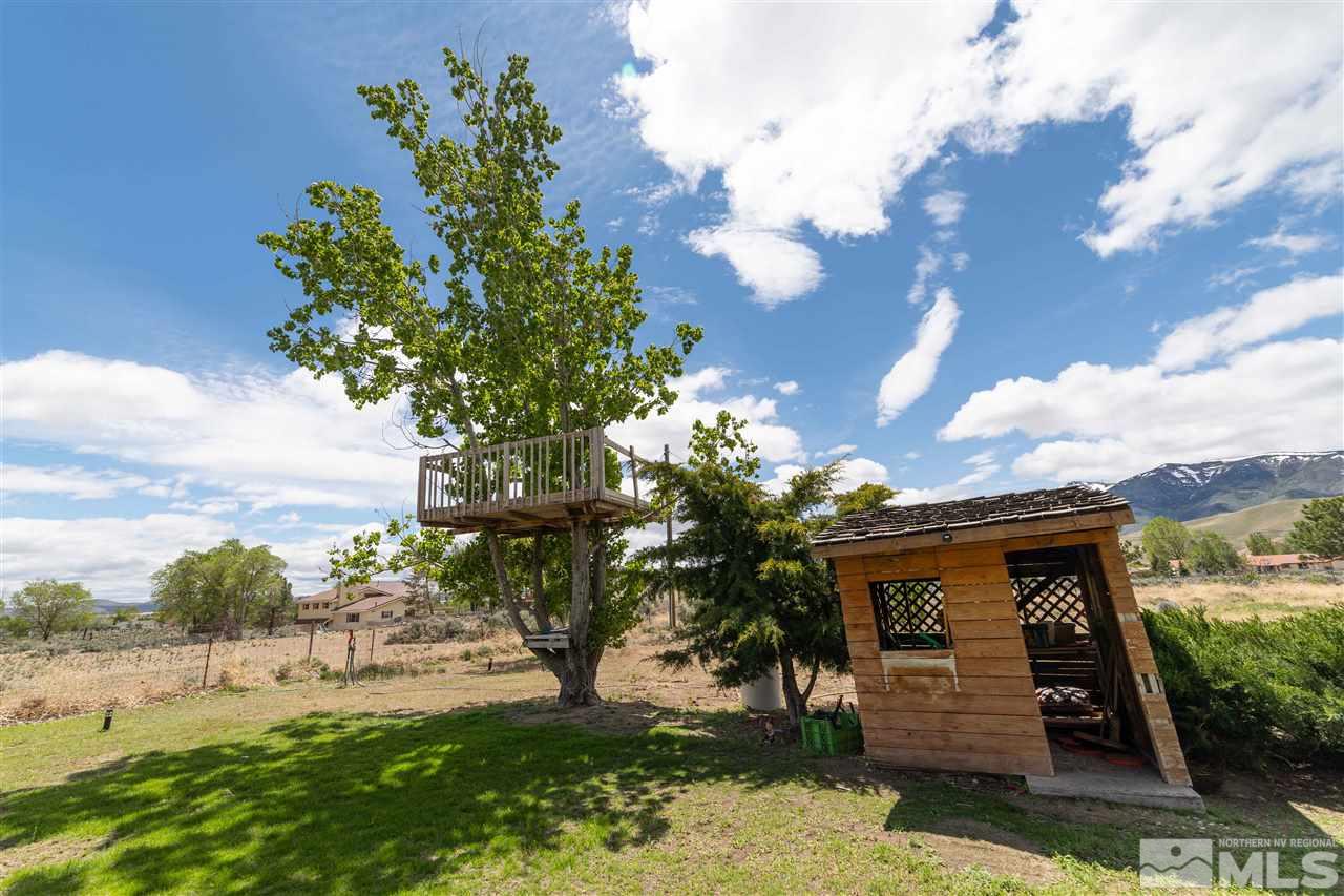 10813 Santa Fe Road Reno, NV 89508 - Photo 22 of 25 a front view of a house with a yard