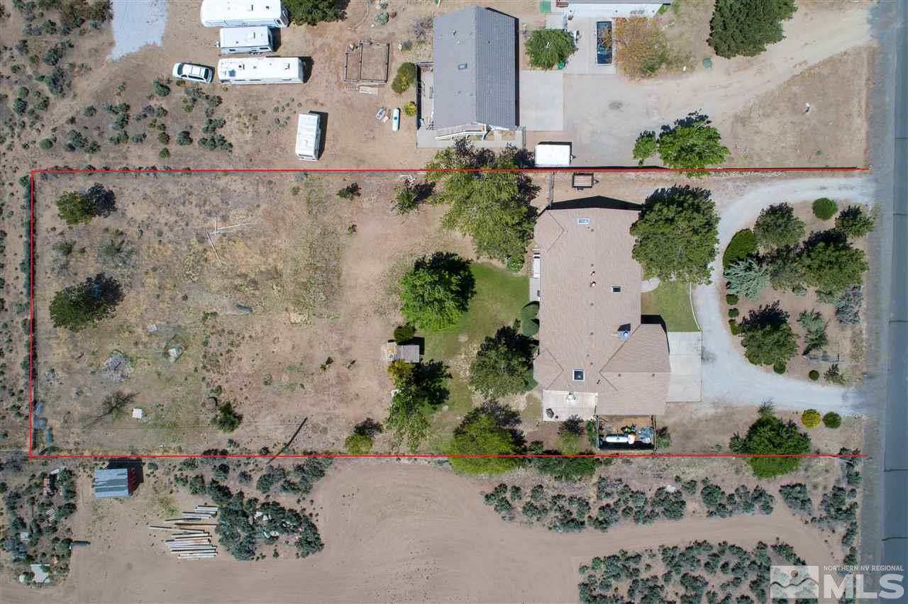 10813 Santa Fe Road Reno, NV 89508 - Photo 24 of 25 an aerial view of a house with a yard and large trees