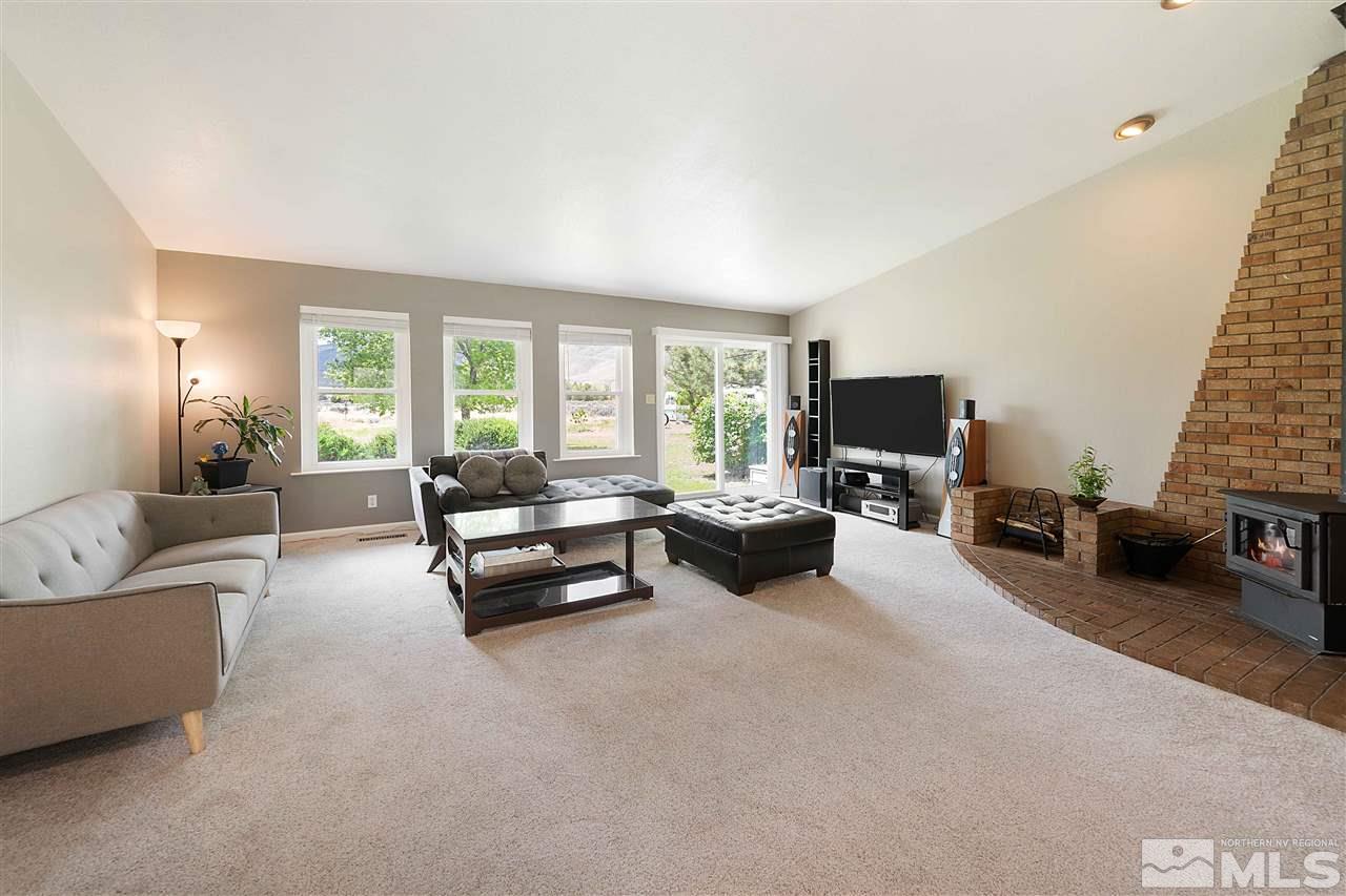 10813 Santa Fe Road Reno, NV 89508 - Photo 3 of 25 a living room with furniture and a flat screen tv