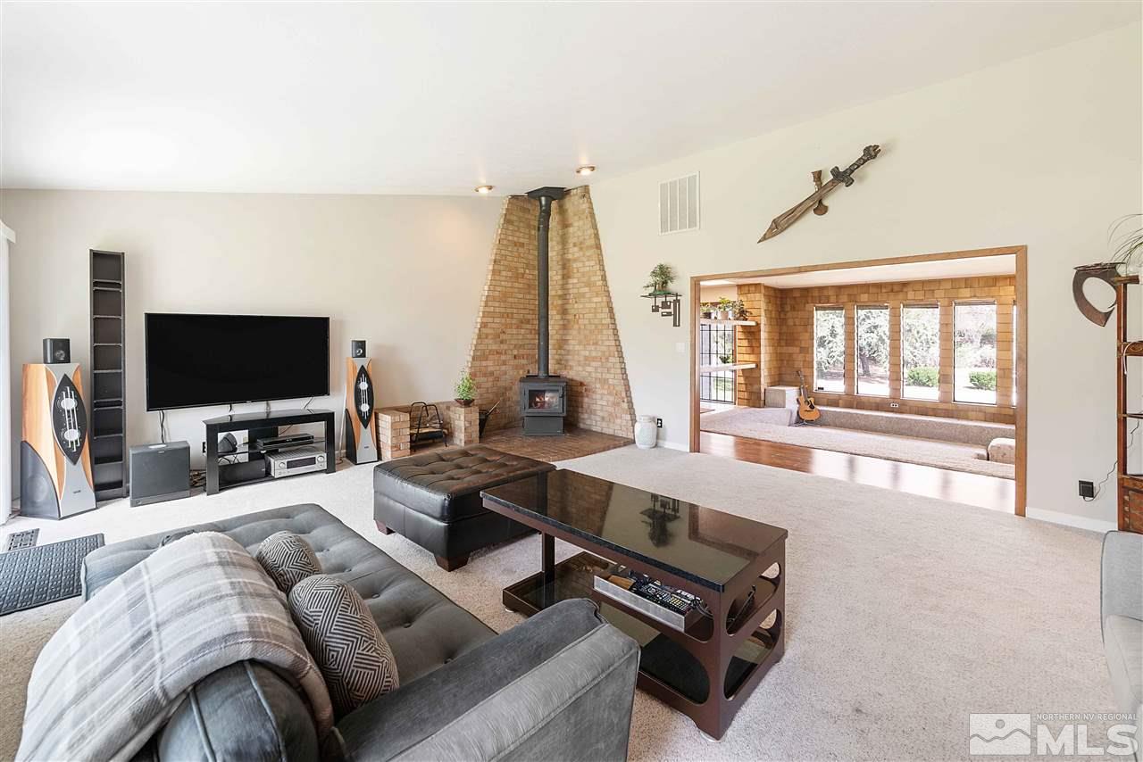 10813 Santa Fe Road Reno, NV 89508 - Photo 4 of 25 a living room with furniture and a flat screen tv