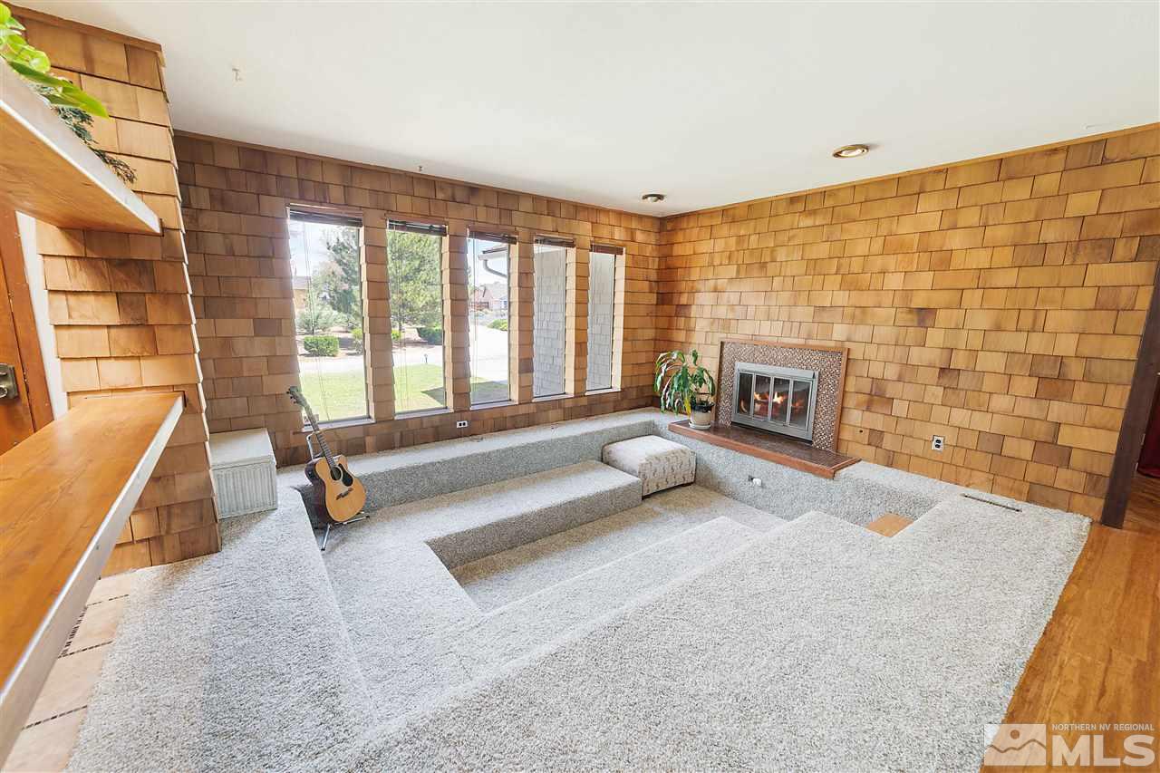 10813 Santa Fe Road Reno, NV 89508 - Photo 6 of 25 a living room with furniture and a fireplace